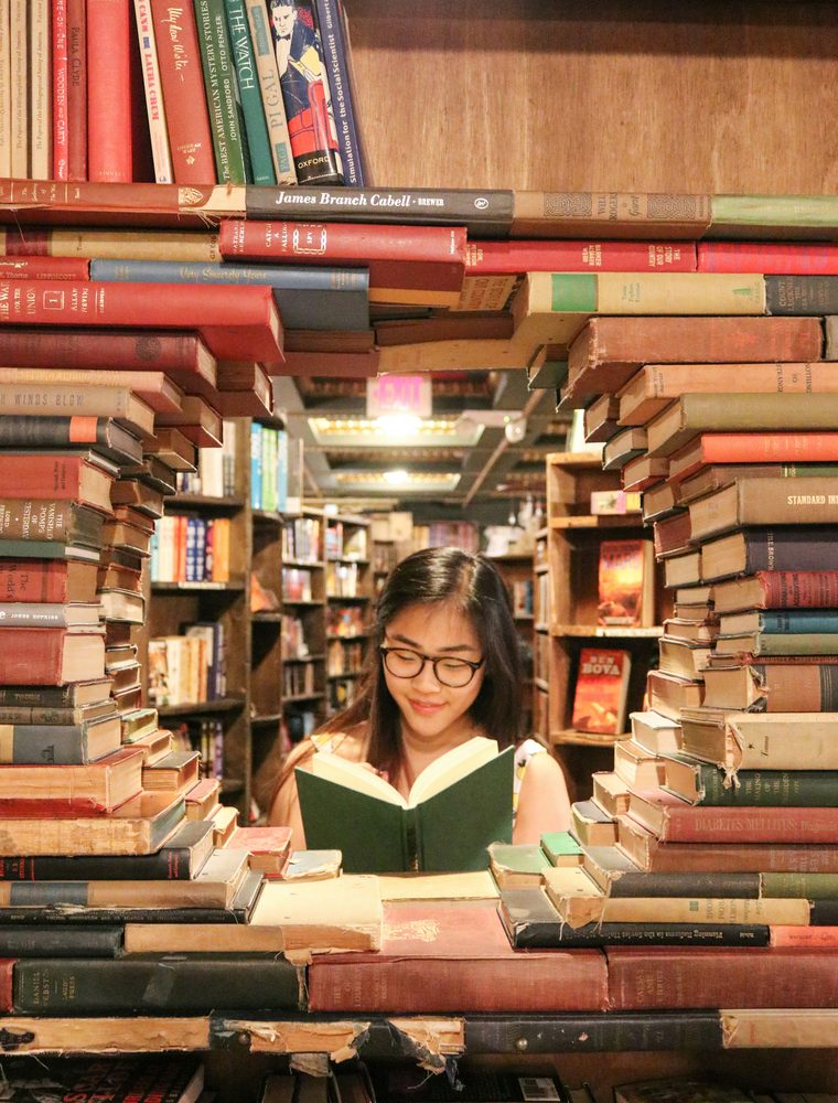 A student reading in a bookshop